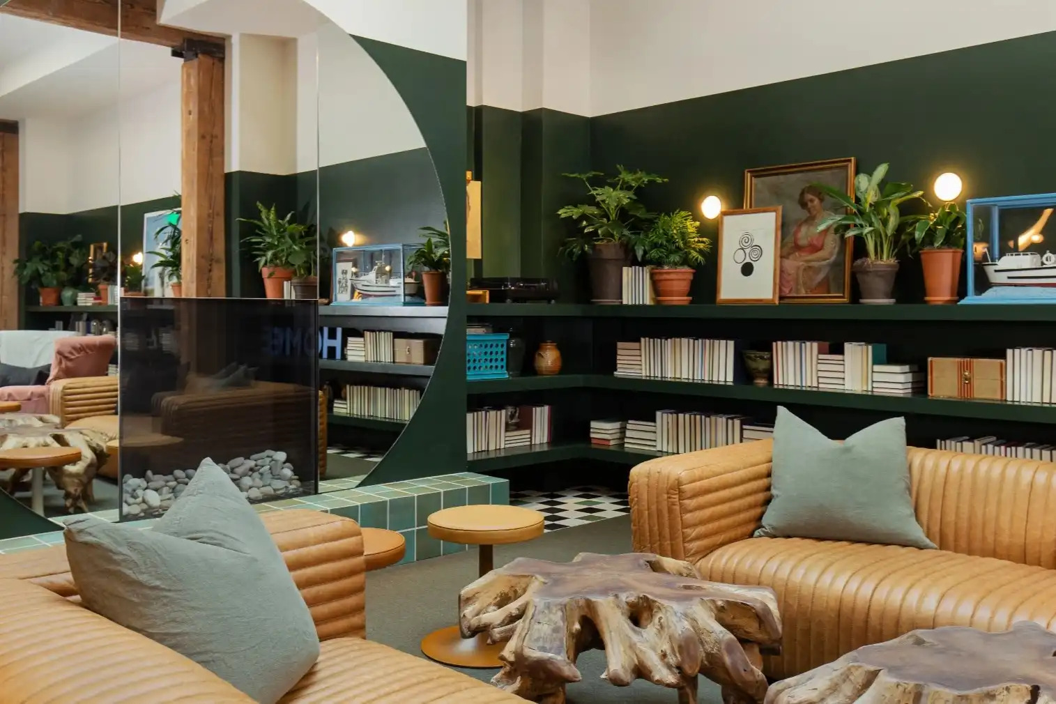 Modern hotel lounge with geometric wood wall, grey sofa, and contemporary Pacific Northwest design